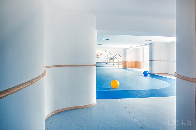 漸變藍色半墻木質(zhì)弧形裝修設(shè)計機構(gòu)活動室