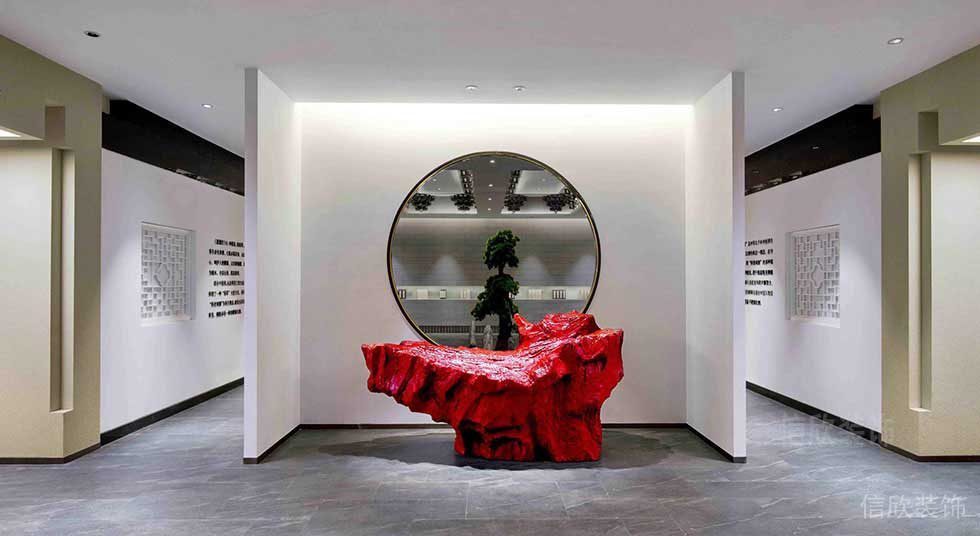 辦公室前臺(tái)區(qū)裝修效果圖鏡面圓形大廳裝修紅色石材展示藝術(shù)品效果圖