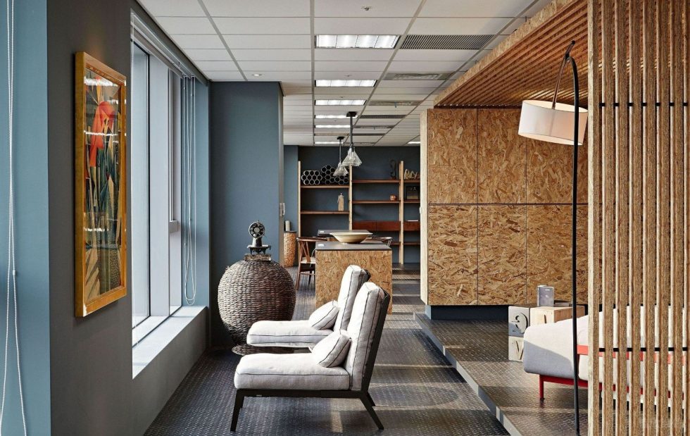 深圳寶安陽基九方廣場600平方米北歐工業(yè)風(fēng)公司裝修案例員工休閑區(qū)米色布藝單人沙發(fā)組合