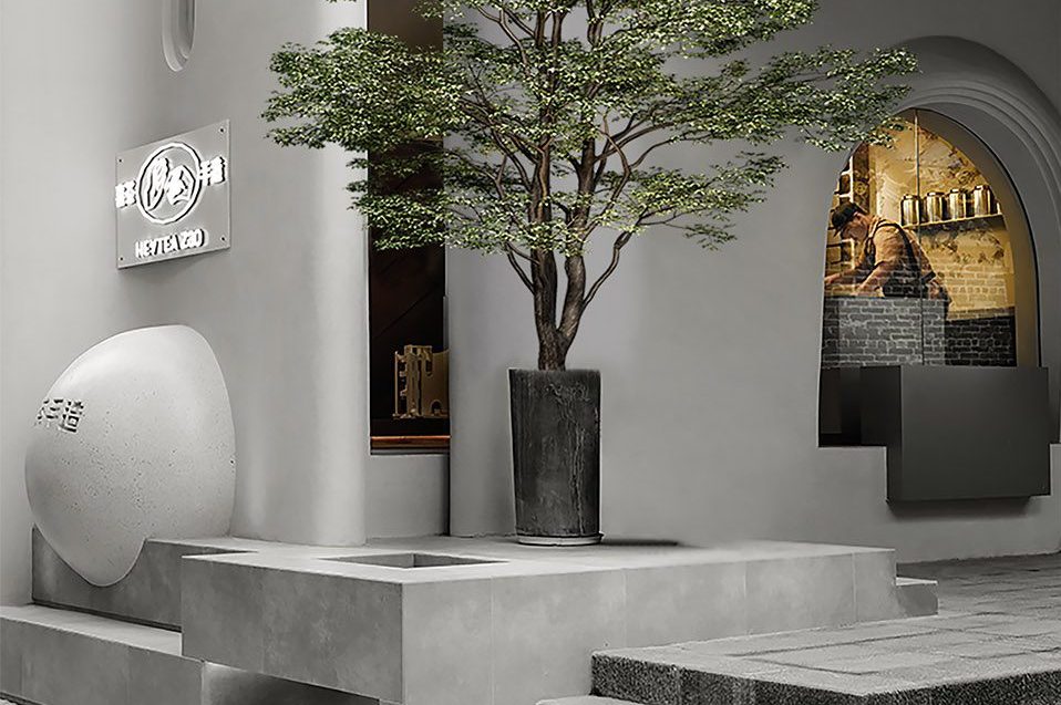 簡約侘寂風(fēng)飲品店門口擺放綠植樹裝修圖