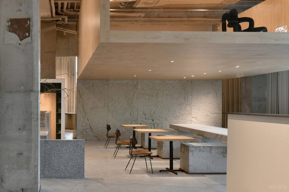 工業(yè)原木風展廳裝修案例 天然石材墻面中島臺及木桌