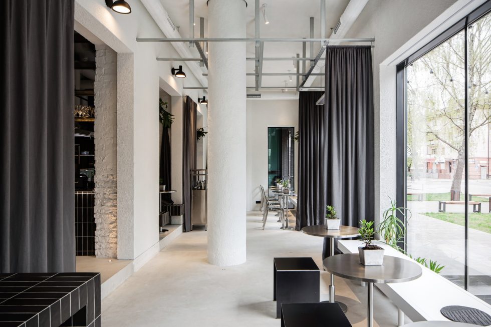 現(xiàn)代極簡風(fēng)咖啡廳深灰簾布點(diǎn)綴雅座區(qū)裝修效果圖