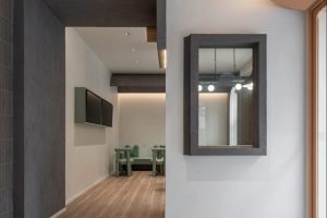 現(xiàn)代簡約風(fēng)飲品店黑色微水泥門洞燈帶裝修設(shè)計(jì)