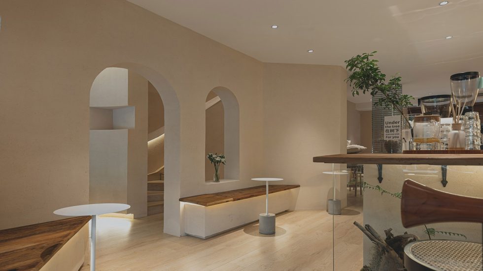 原木奶油風(fēng)咖啡廳弧形門洞裝修示意圖